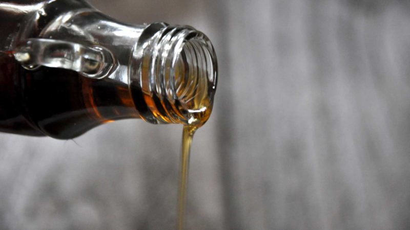 maple syrup pouring from bottle